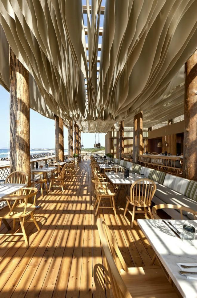 Outdoor Restaurant Styles and Ideas  Outdoor Restaurant Styles and Ideas Barbouni Greece Outdoor restaurant ideas beach view wood and white vith layered curtains