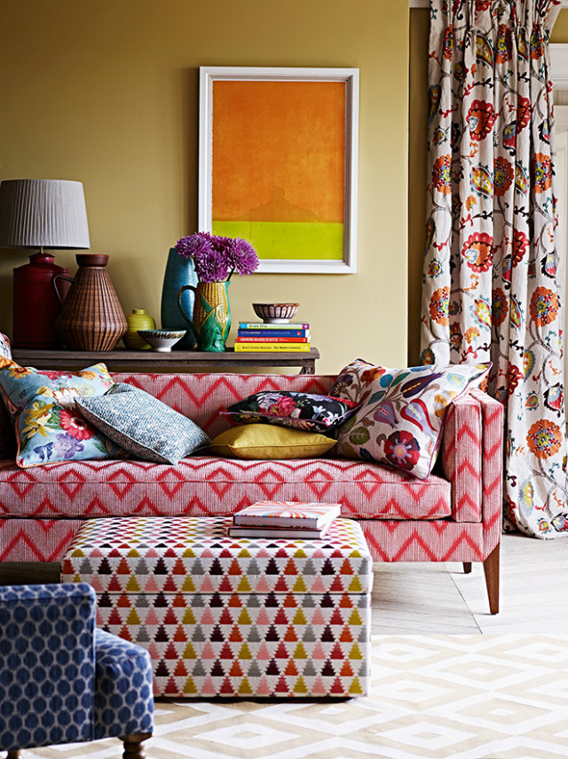 colours and patterns Mix Your Fabrics, Colours and Patterns with No Fear Mixed Fabrics flower pillows gemoetris red sofa orange yellow painting