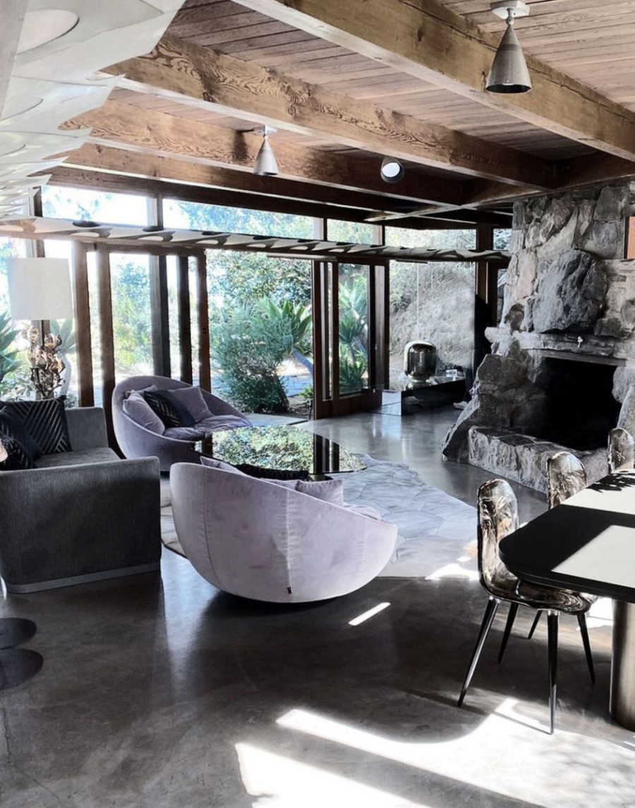 Davide Rizzo Architects Frank Lloyd Wright Bungalow living room with two purple chairs that resemble beanbags, a grayish couch and a big cozy fireplace.  davide rizzo architects Davide Rizzo Architects: Best Interior Design Projects Davide Rizzo Frank Loyed BangallowBill 2 1 0x1200 c default