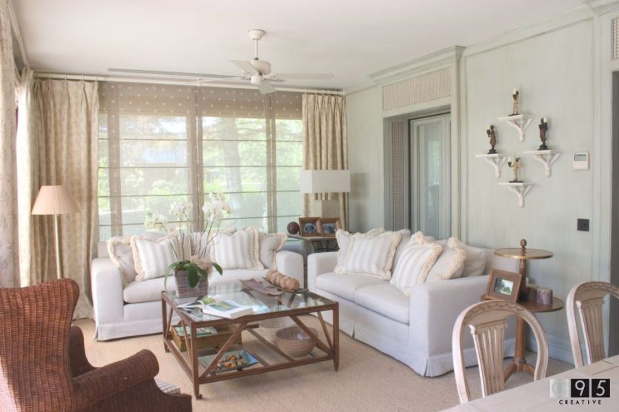 decorative elements, white sofas, white cushions, glass and wood center table, brown armchair, floor lamp euroamykasa Euroamykasa Inspiring Interiors Euroamykasa Inspiring Interiors1 5 1
