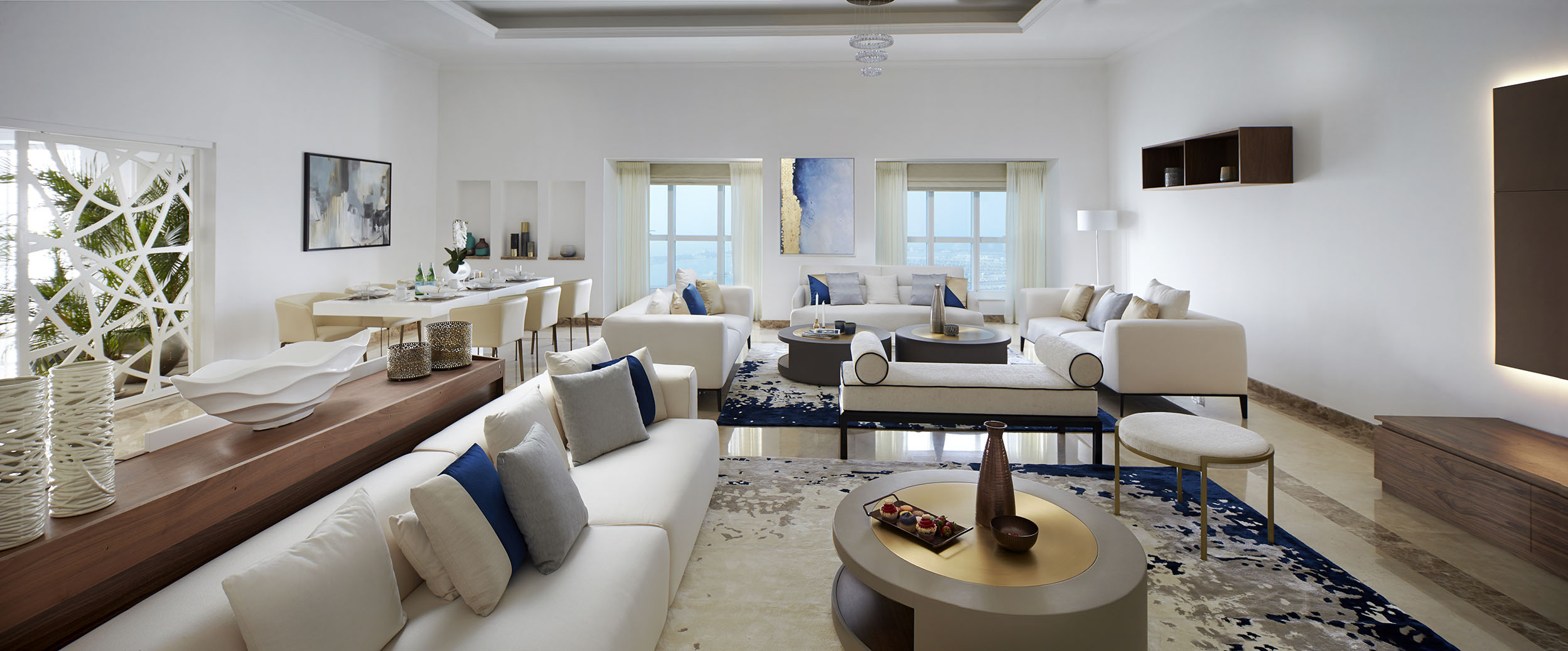 Zen Interiors, living room, white leather sofa, white sofa, leather sofa, rug, cushion, wood console, white leather center table, center table, leather center table, white center table. zen interiors Zen Interiors – Best Interior Design Projects Zen Elite 01 resized