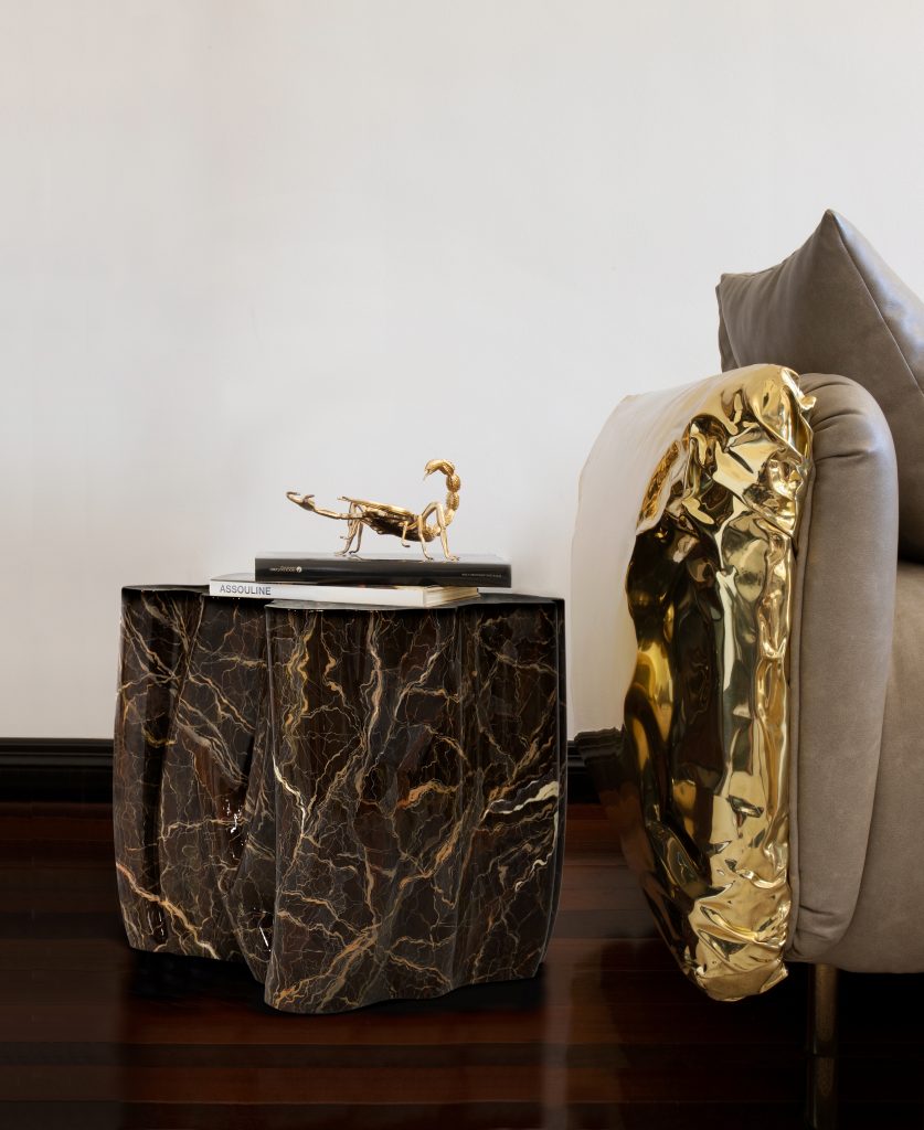 marbled side table in brown tones and gold detailed armchair modern living room furniture Modern Living Room Furniture: Unique and Functional Side Tables brown marbled side table 837x1024