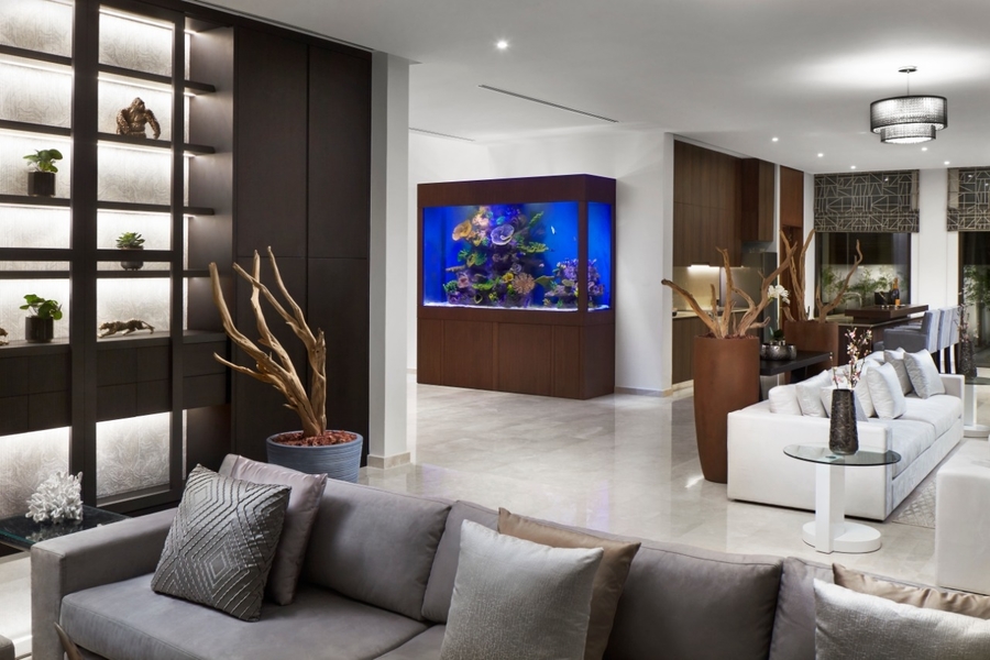 Zen Interiors, dining room trends, silver velvet sofa, velvet sofa, silver sofa, white velvet sofa, white sofa, velvet sofa, aquarium, glass side table, wood vases. zen interiors Zen Interiors – Best Interior Design Projects zen interiors1