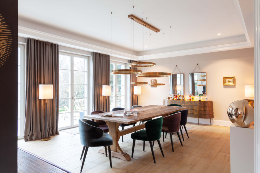 Dopo Domani, STADTVILLA dining room with a rectangular dining table surrounded by green, purple and grey dining chairs.  dopo domani 10 Stunning Dopo Domani Interiors To Inspire You 20181130 dopo domani H c 024 scaled 1