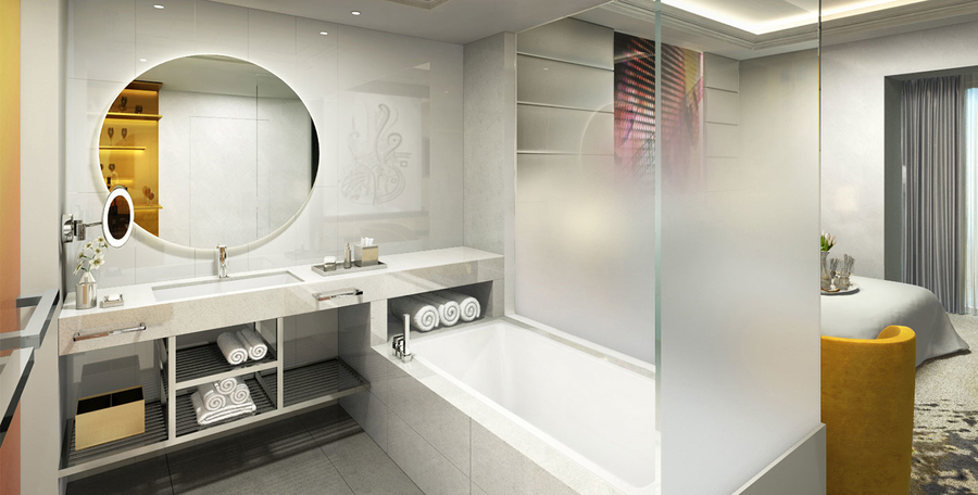 White bathroom with glass walls accompanied with marble wash basins and bathtub.
 hba HBA – The Best Interior Design Projects in Dubai HBA6