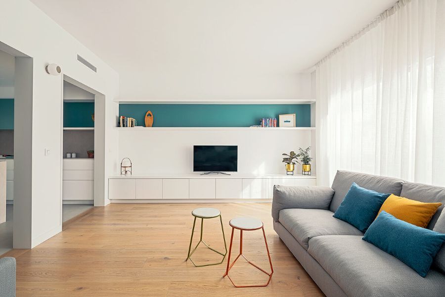 grey sofa, blue and yellow cushions, tv, decorative elements nook architects Nook Architects Best Interior Designs Nook Architects Best Interior Designs1 11 1