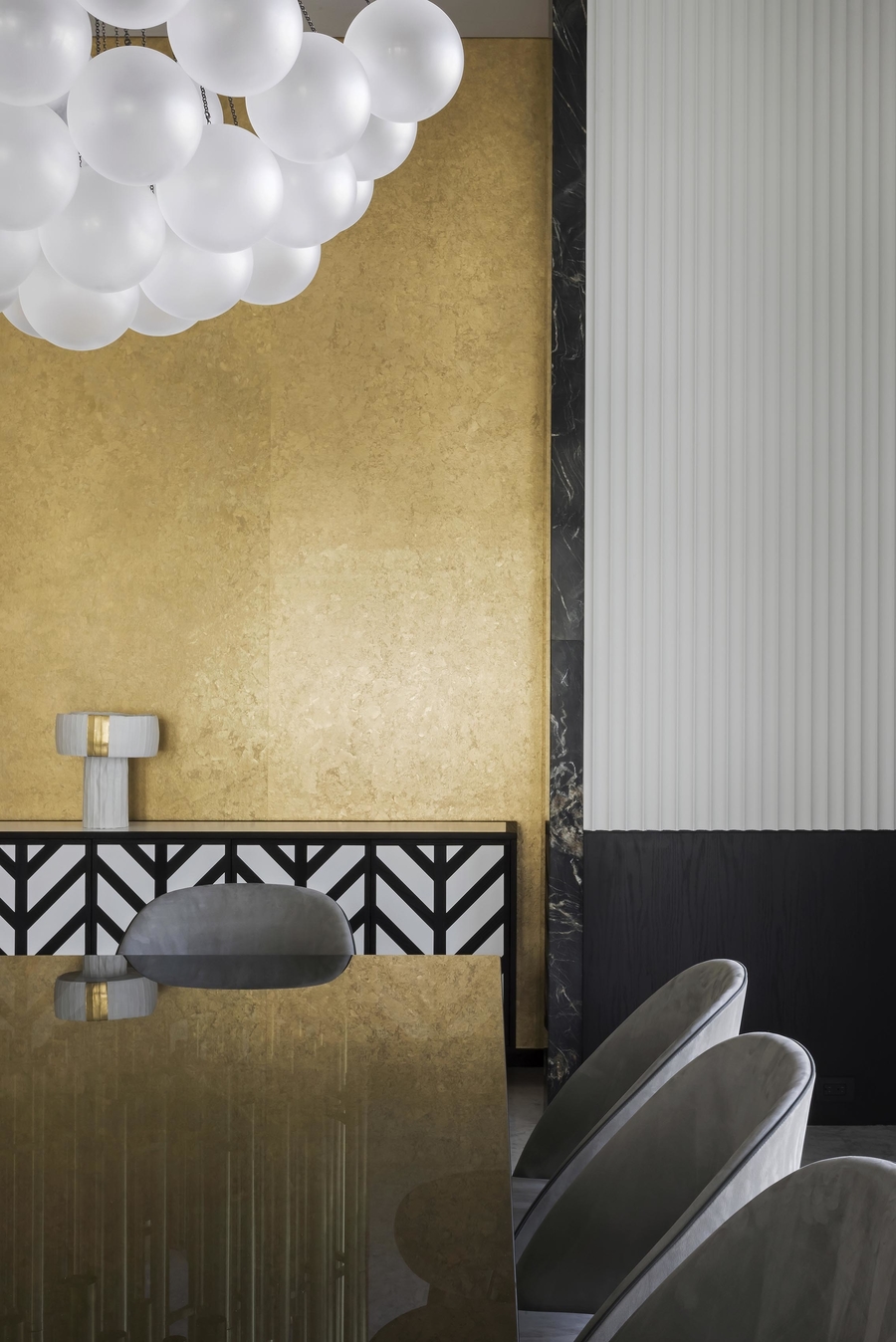 A dining room with gold details completed with some custom upholstery.  vshd design VSHD Design – Minimalist Interior Designs Inspirations Webp