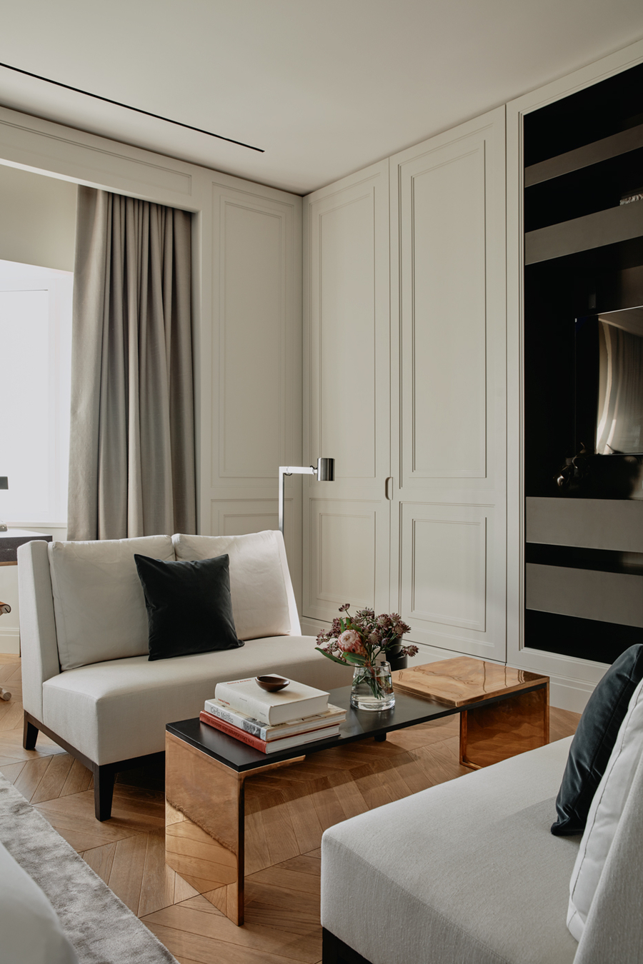 A living room with a copper center table accompanied with some bespoke upholstery.  vshd design VSHD Design – Minimalist Interior Designs Inspirations Webp