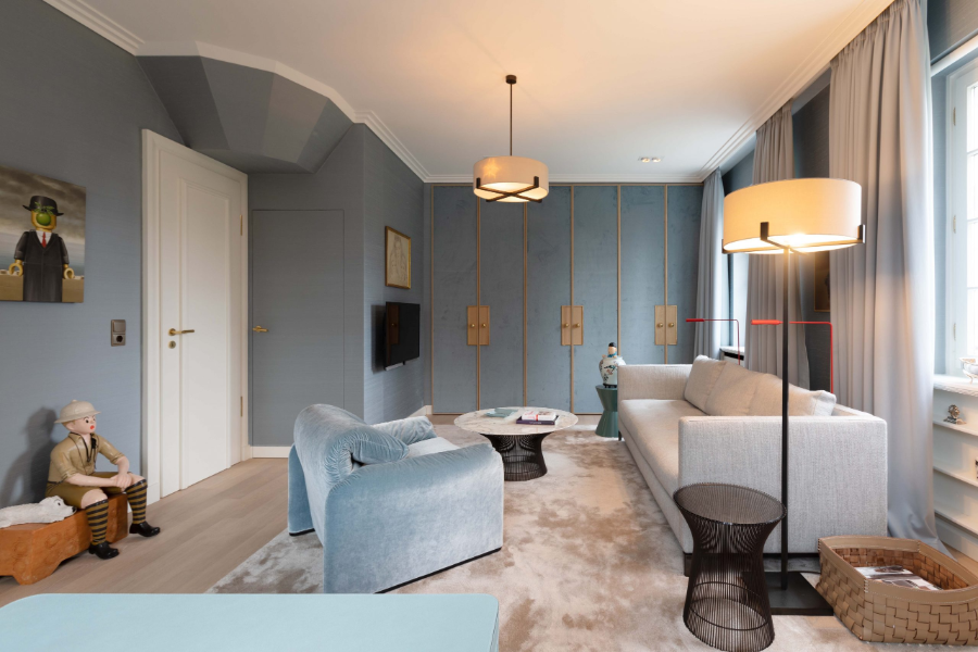 Dopo Domani, REFRESH EINFAMILIENHAUS other living room with one light grey sofa, a baby blue armchair, a side table and one center table, as well as a floor lamp.  dopo domani 10 Stunning Dopo Domani Interiors To Inspire You dopo domani Private Residence B 005 scaled 1