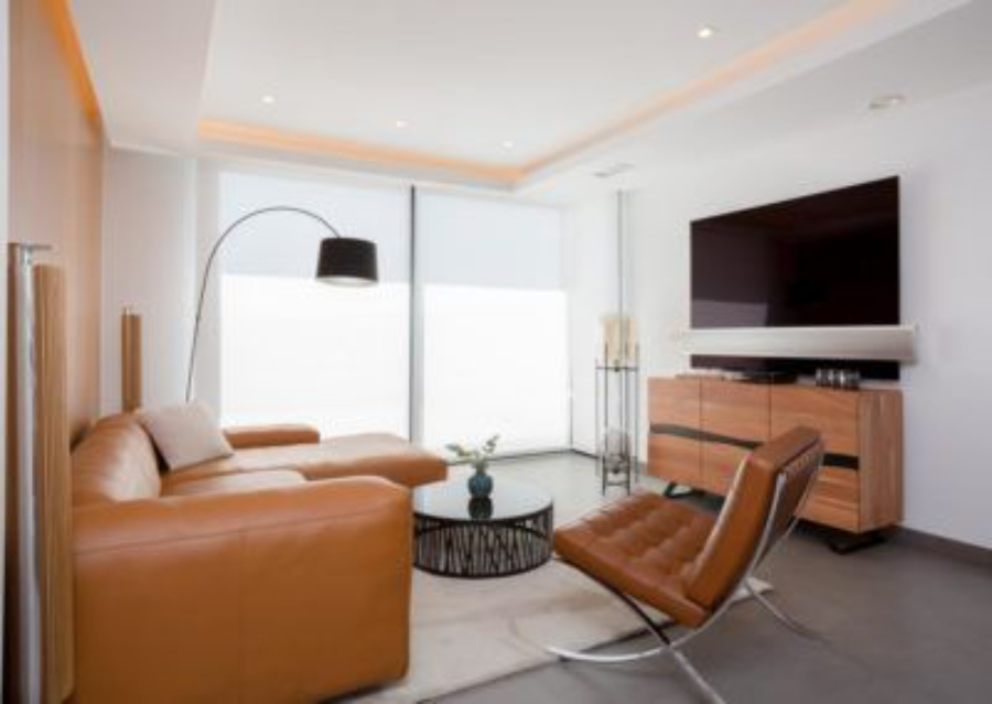 Living room with brown sofa and armchair, black coffee table, white rug, brown console and tv pietan Pietan Design Modern Style Inspirations Pietan Design Modern Style Inspirations1 4