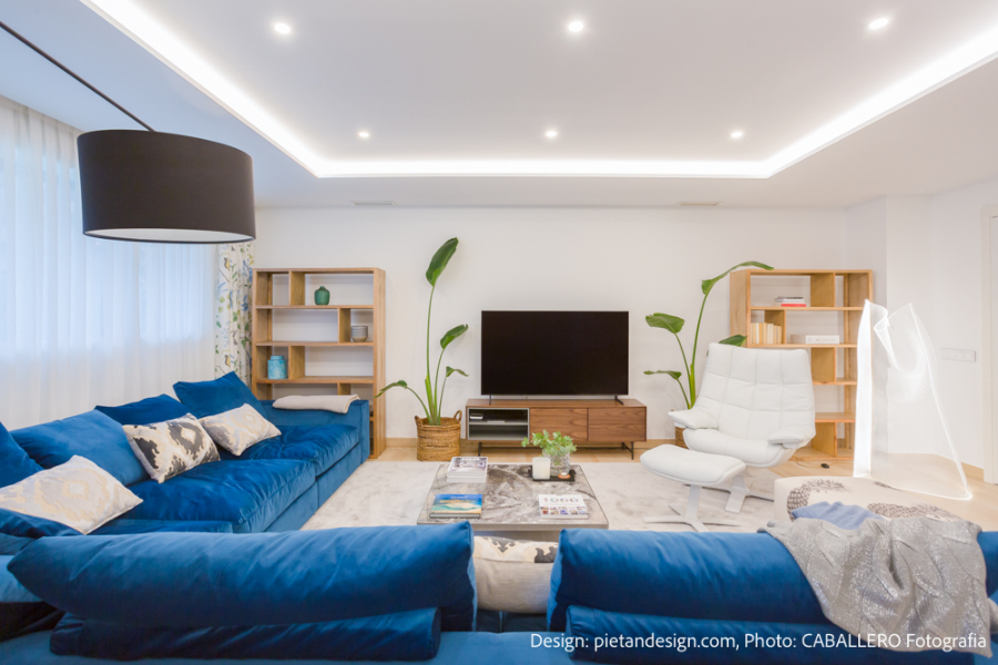 living room with blue sofa, brown libraries and console pietan Pietan Design Modern Style Inspirations Pietan Design Modern Style Inspirations1 6 1