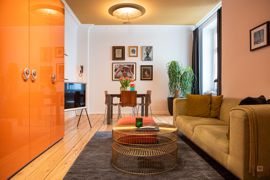 THE INNER HOUSE: living room with a yellow sofa, a unique center table and a view to the dining room  the inner house THE INNER HOUSE: Modern Interior Design Ideas Aptm Berlin V THE INNER HOUSE Living room decor ideas