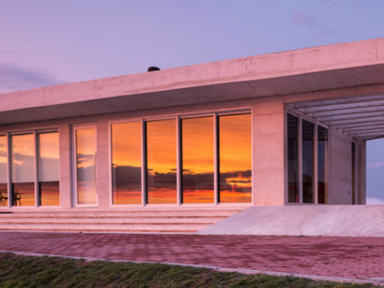 Hilltop Brazil residence built from white concrete by HLM House by Rafael Lorentz