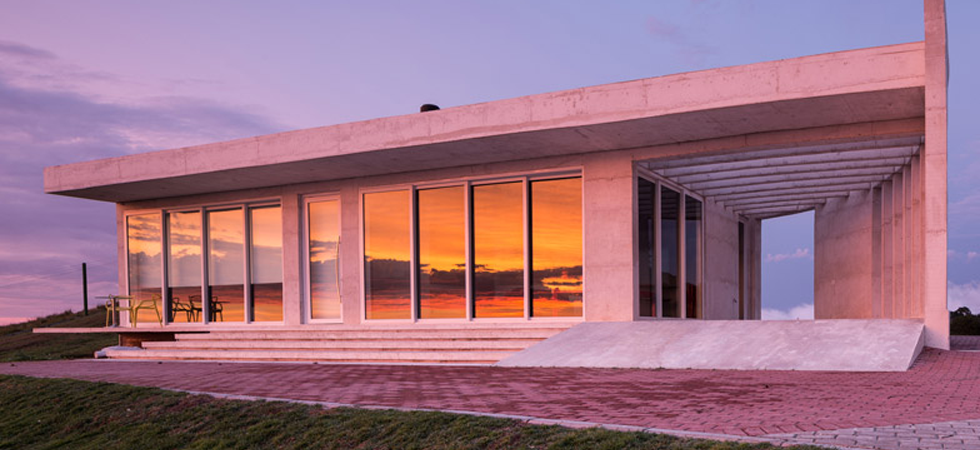 Hilltop Brazil residence built from white concrete by HLM House by Rafael Lorentz