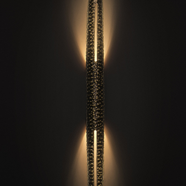 Shaka Zulu was one of the most influential monarchs of the Zulu Kingdom. The SHAKA Wall Light came to life by the hands of our team of designers and craftsmen, composed by hammered brushed aged brass. SHAKA is the piece that will create a perfect golden l